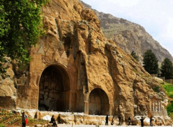 View of the Bisotun UNESCO World Heritage Site in Kermanshah, Iran, showing the Darius the Great inscription carved into Mount Bisotun’s cliff